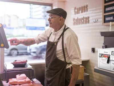 butcher weighing the meat and charging